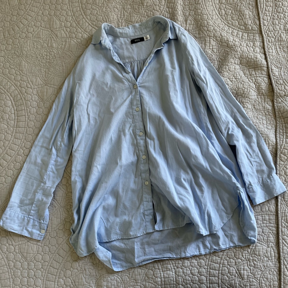 Small BDG light blue shirt. Very light stain on the front, shown in 3rd photo.